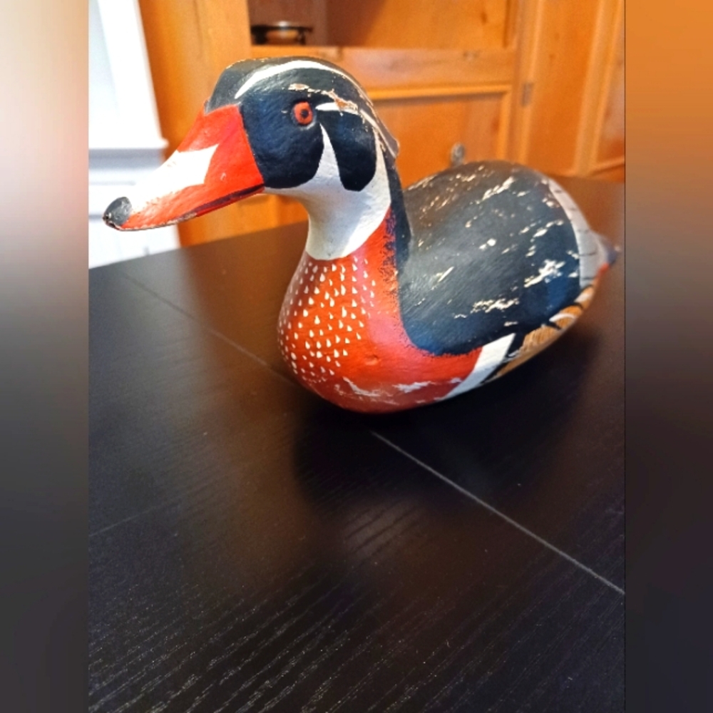 Red and Black Wooden Duck Sculpture with Intricate Detailing